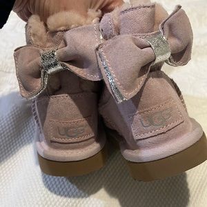 Toddler 10 Uggs light pink with silver stars and bow in the back.  Like new